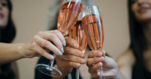 People clinking glasses together to celebrate an occasion in Durbanville