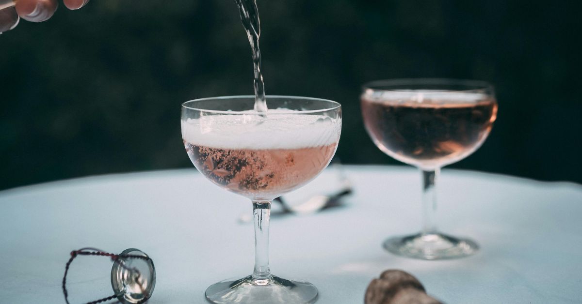 Pouring sparkling rose wine
