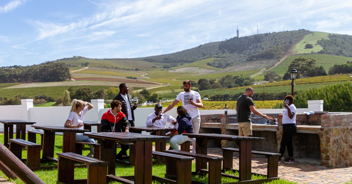 Friends outside having a braai at a wine farm accommodation
