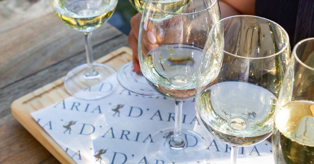 Close up of wine glasses with white wine in them