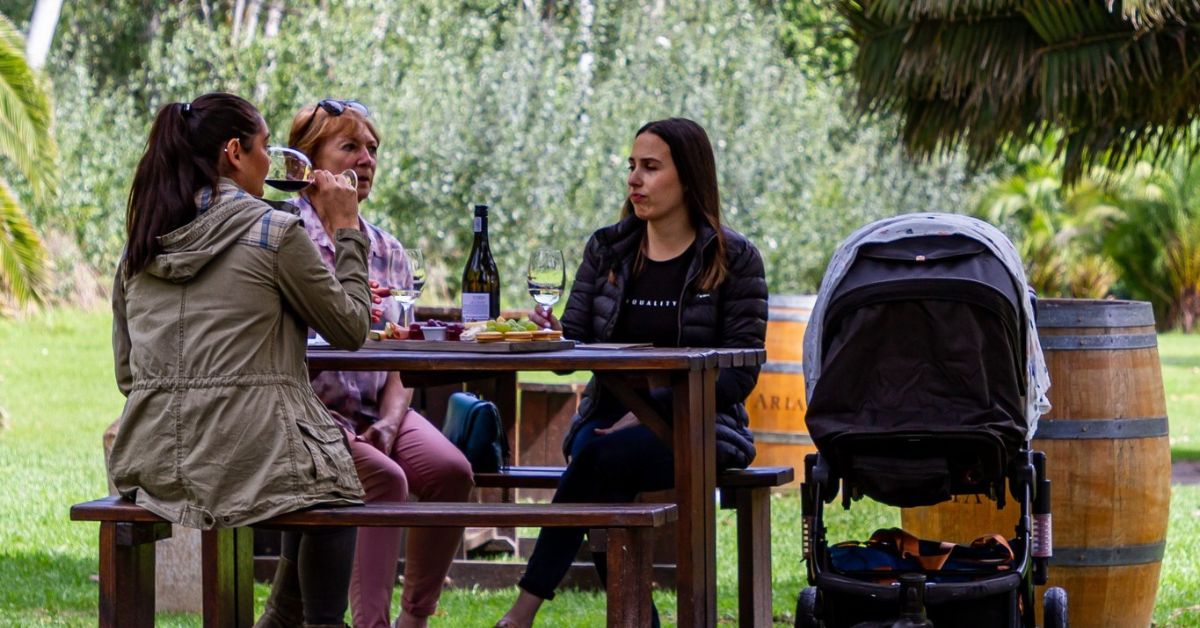 kid friendly wine farms - Family sitting at D'Aria Winery with their baby